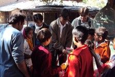 Anil distributing stationery with Jimit - 2